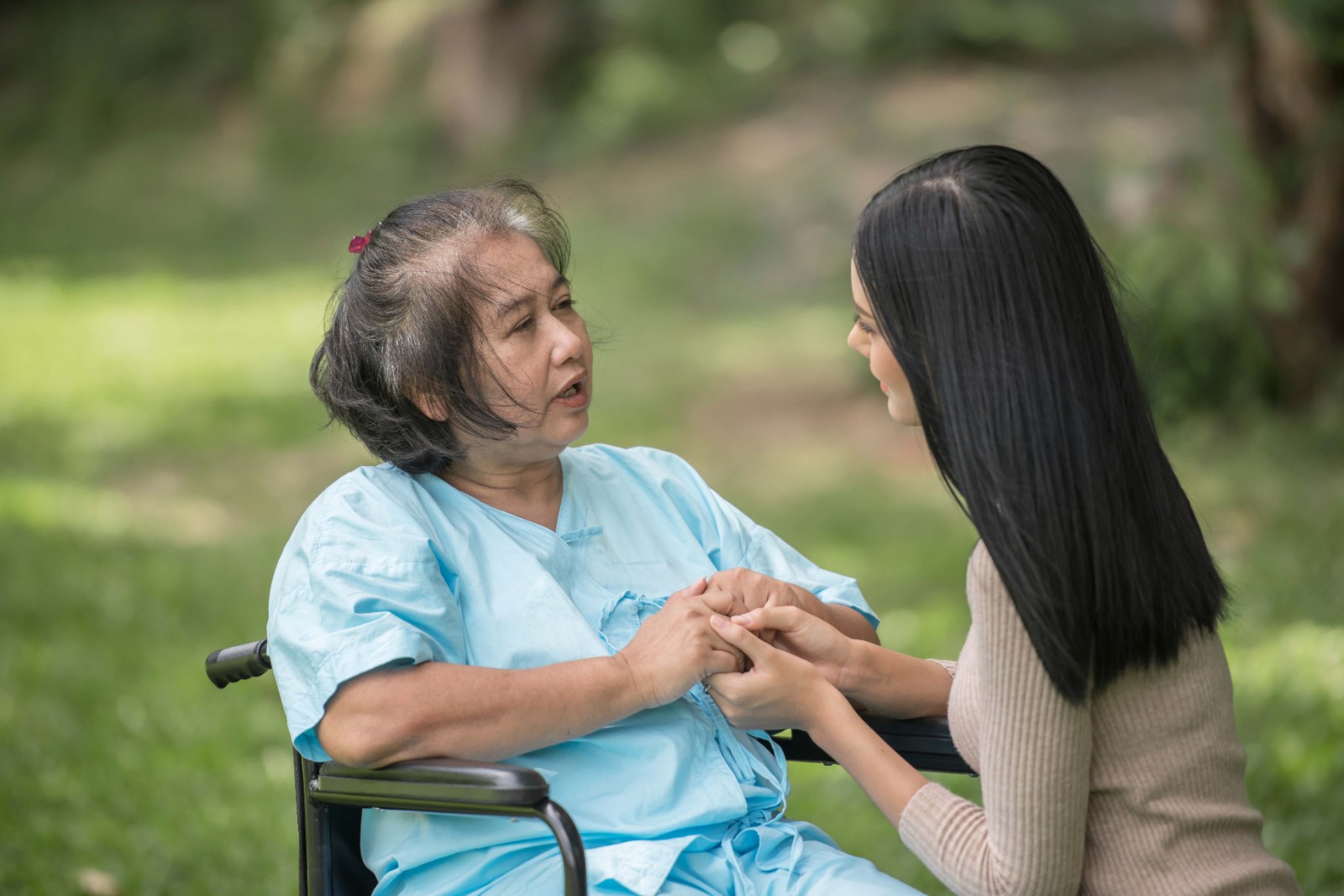 granddaughter-talking-with-her-grandmother-sitting-wheelchair-cheerful-concept-happy-family.jpg